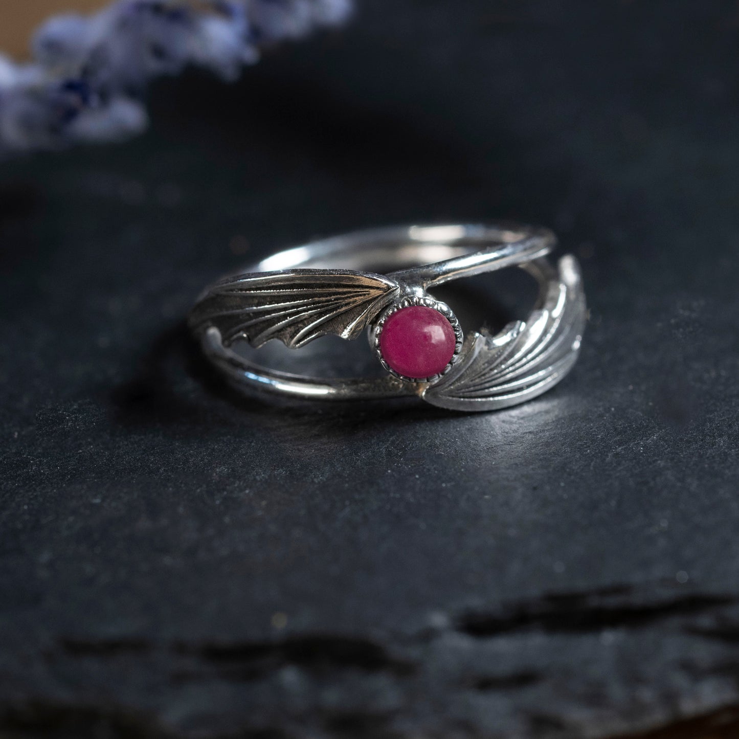 Close-up of the silver wings and the 4mm RUBY stone