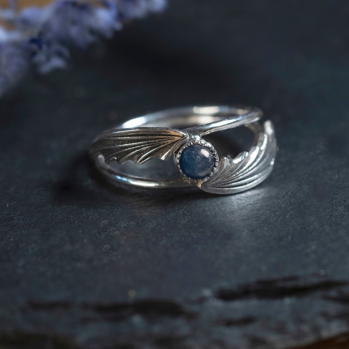 Close-up of the silver wings and the 4mm Sapphire stone