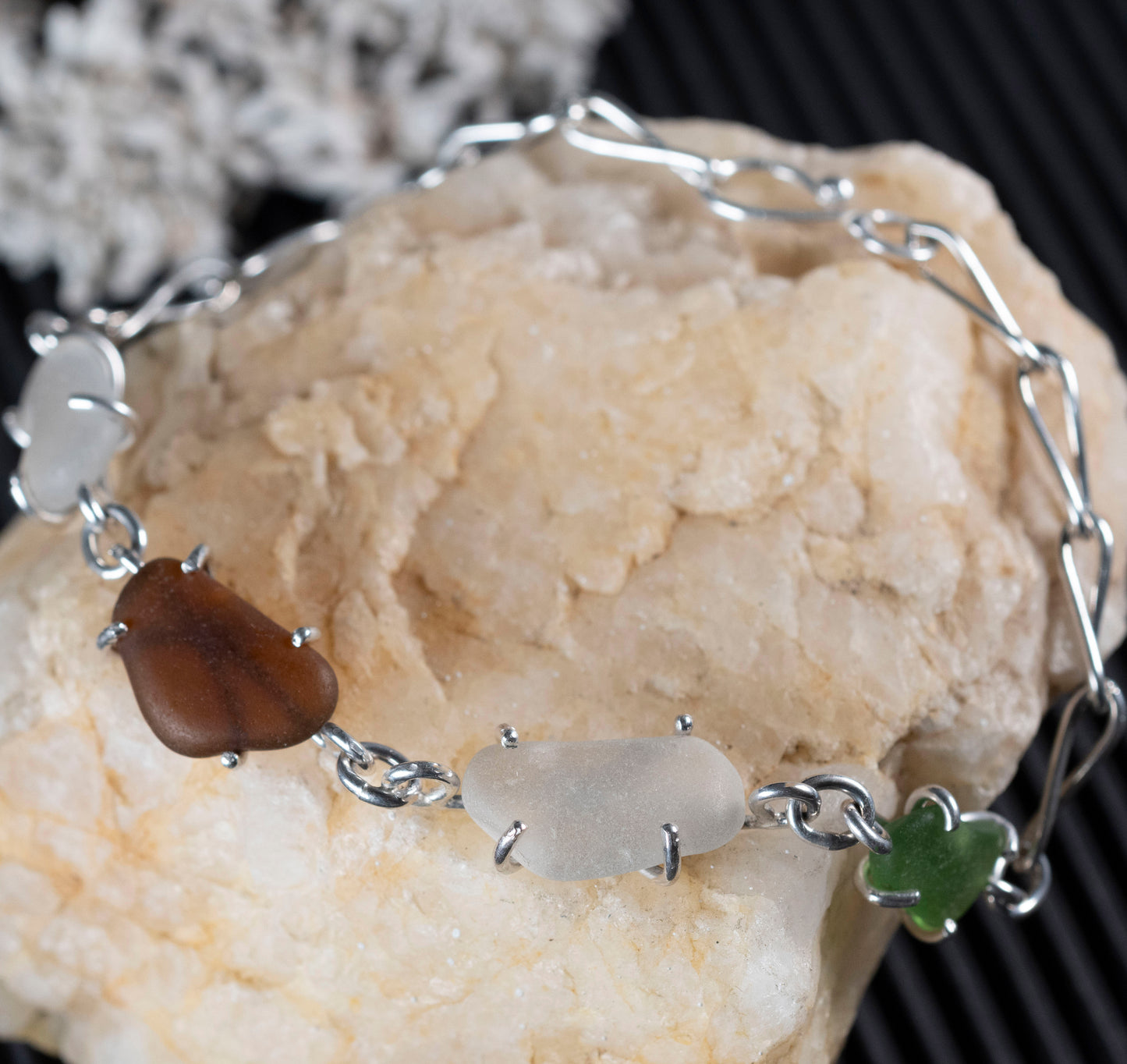 Close-up of the genuine beach glass personally collected for the bracelet.