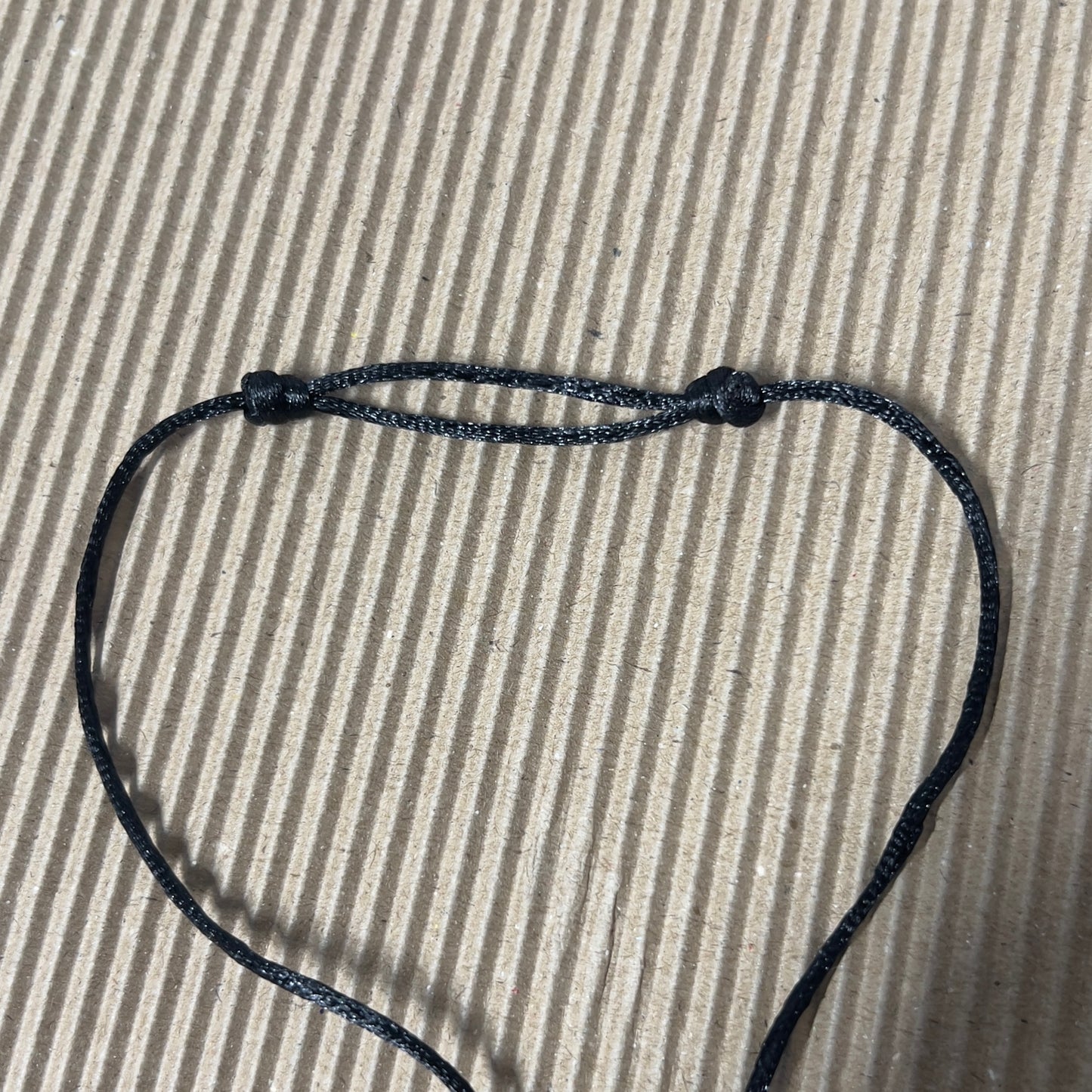 Black satin cord with sliding knots