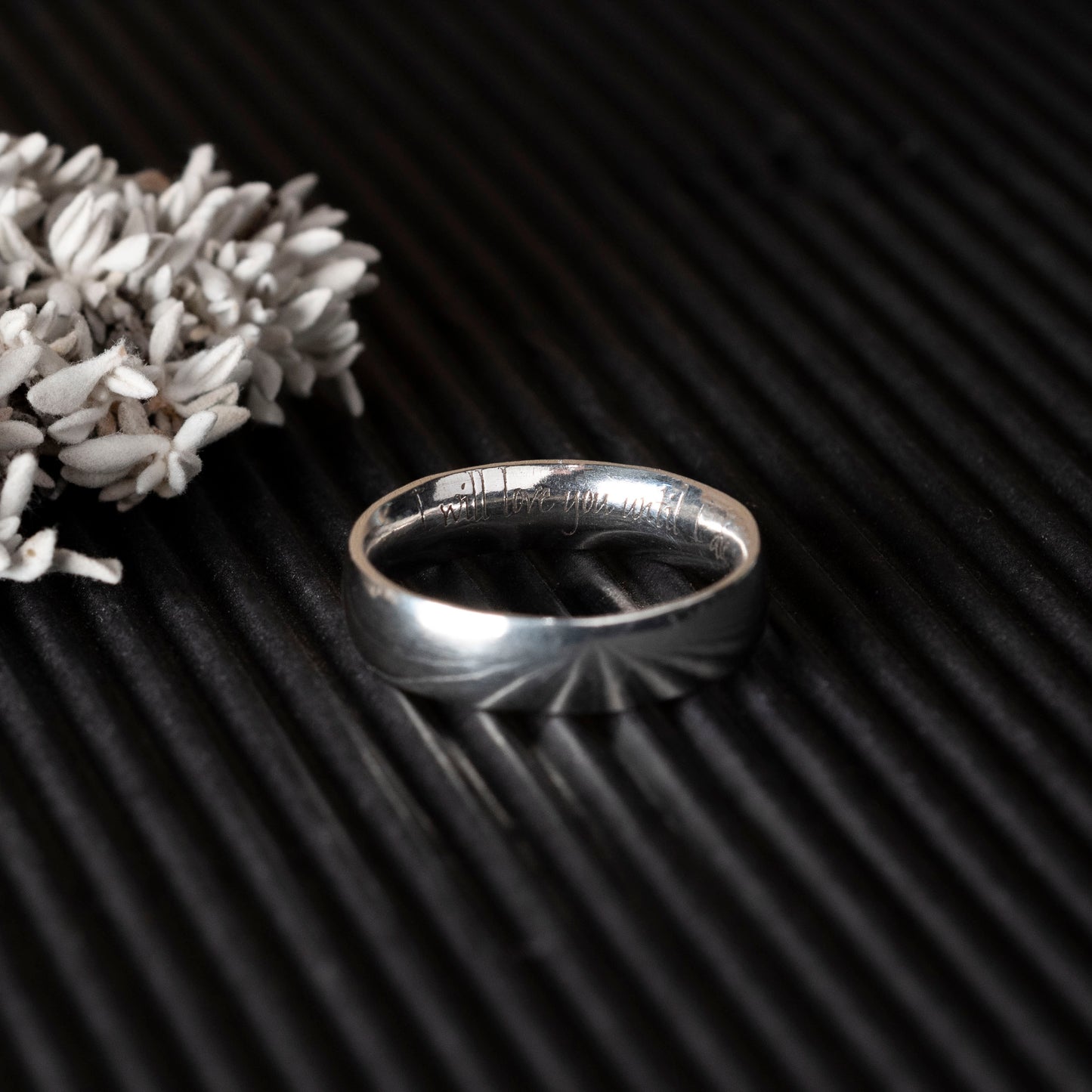 Silver ring with custom quote engraved design 