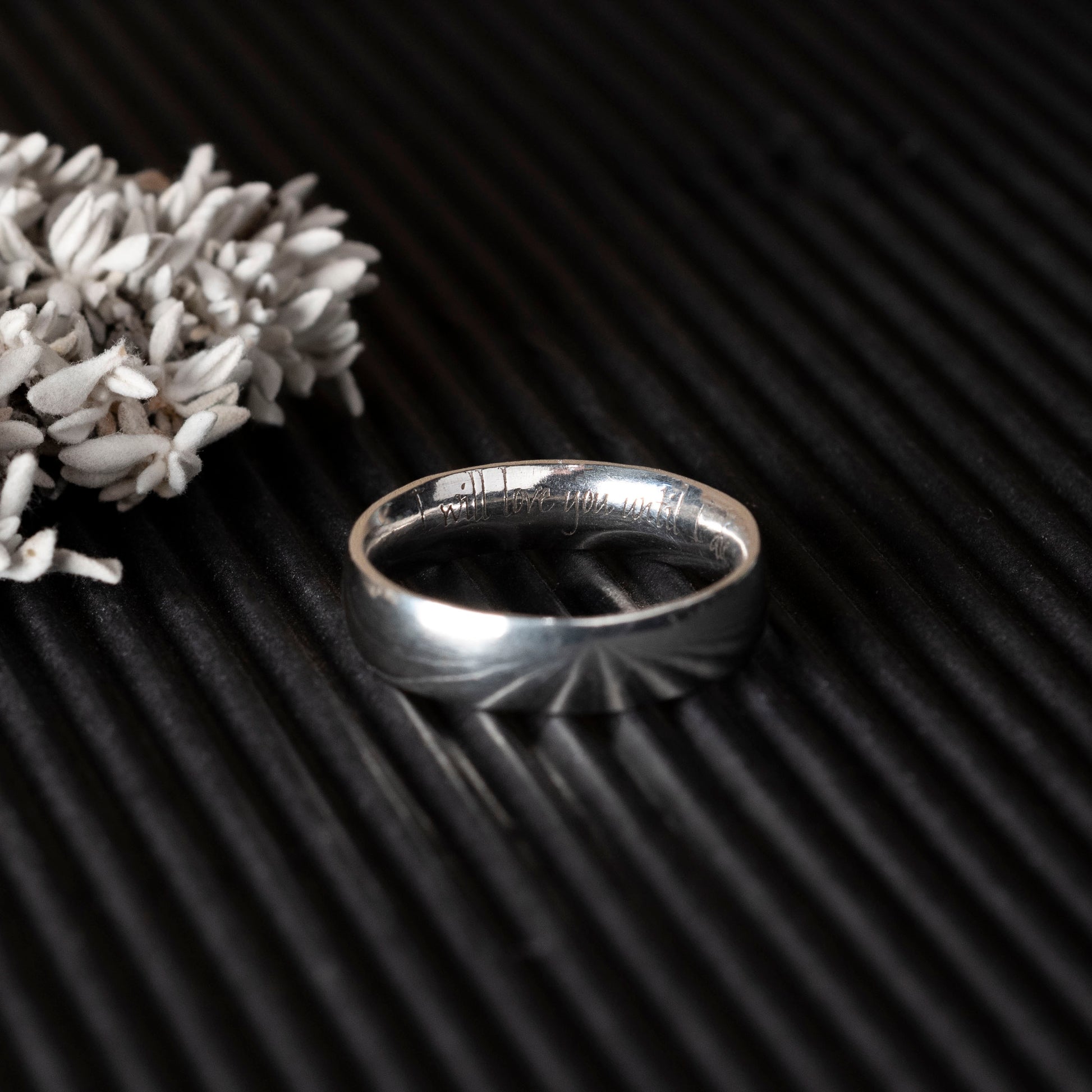 Silver ring with custom quote engraved design 