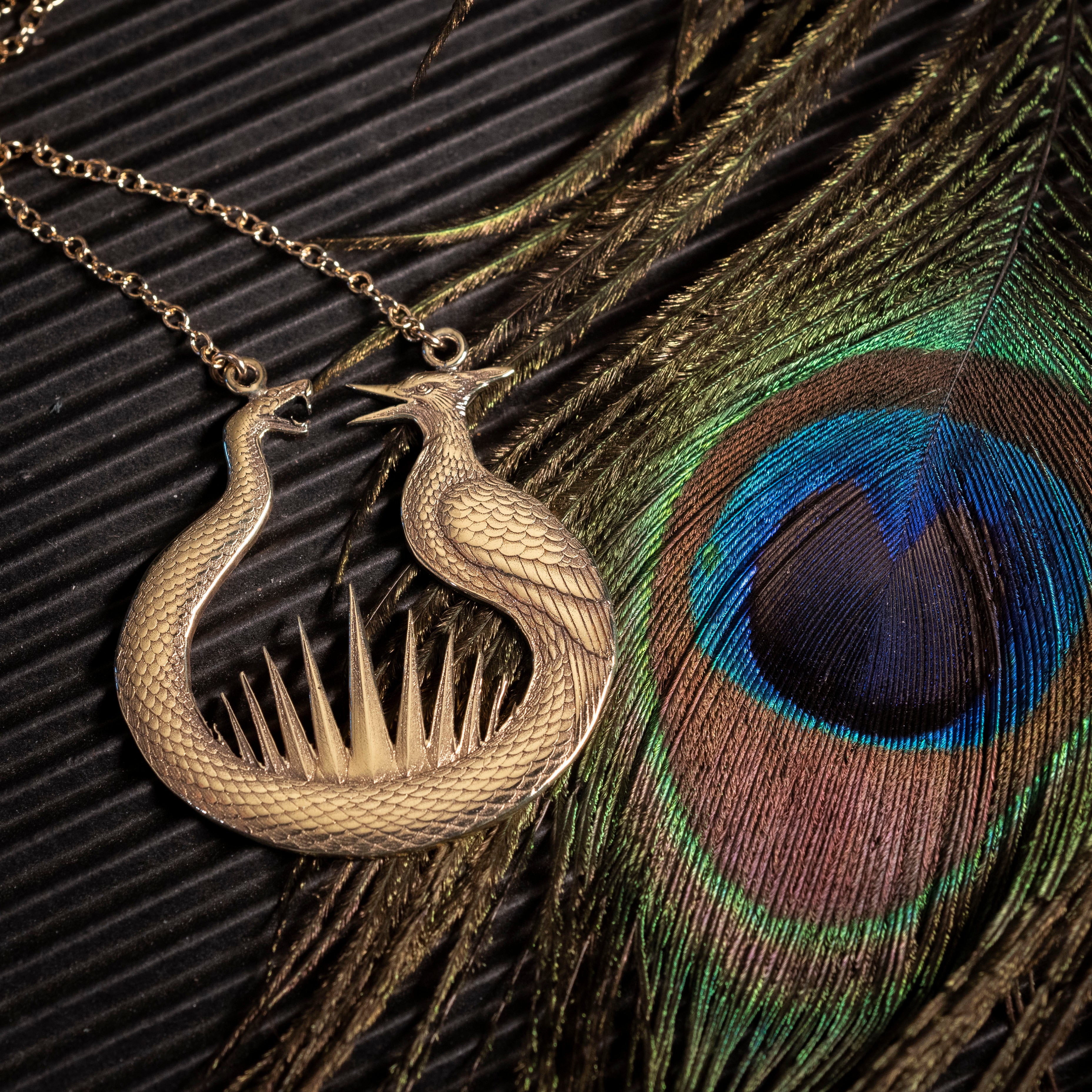 The Sunrise at the Reaping prequel book jewelry in brass.