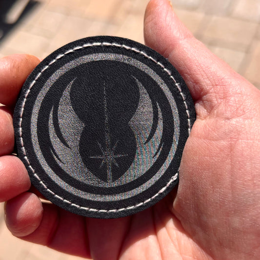 Customizable faux leather iron-on patch with a fantasy design sample.