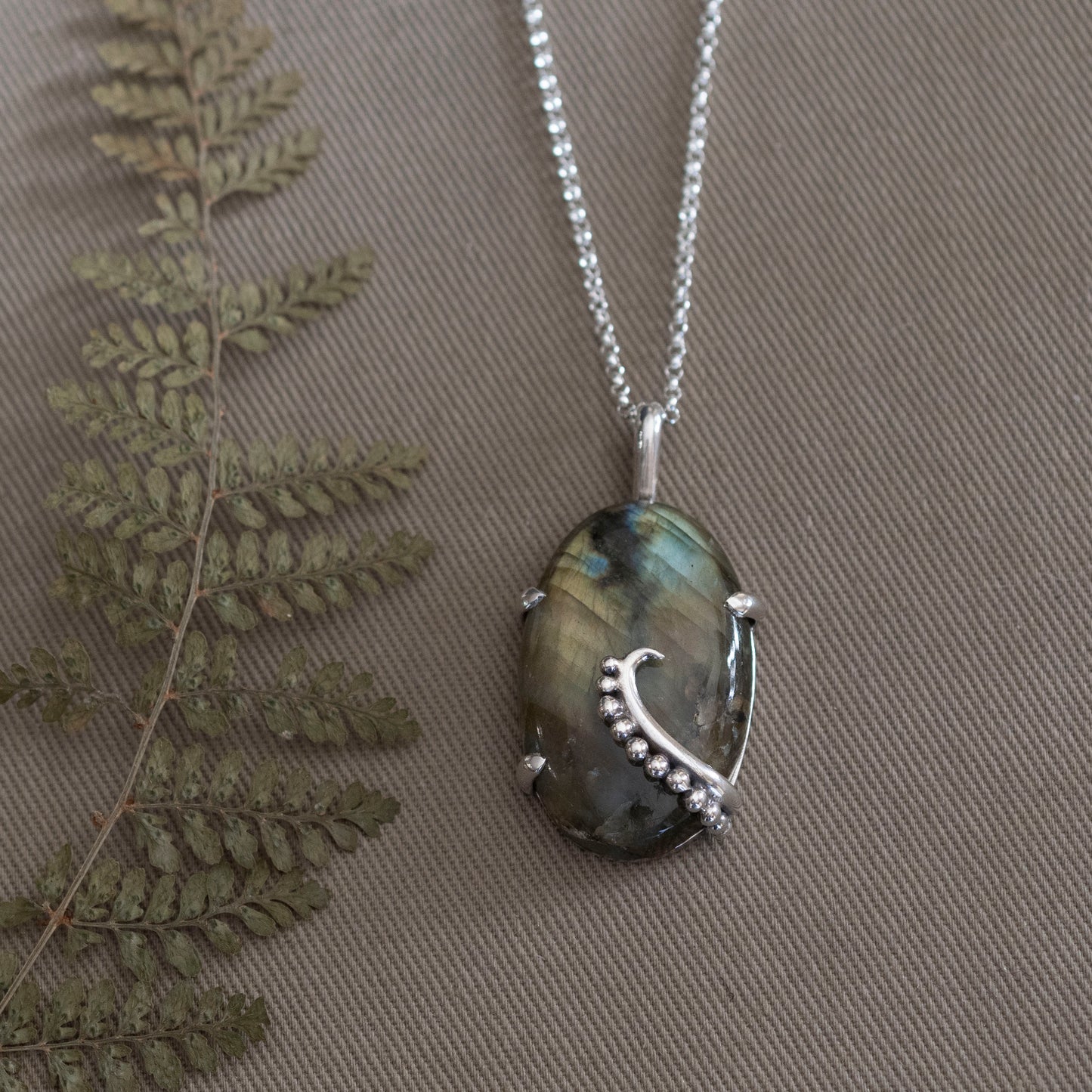 the Uncurling Aurora Pendant - Hebel Design