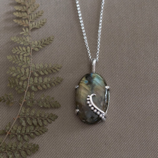 the Uncurling Aurora Pendant - Hebel Design