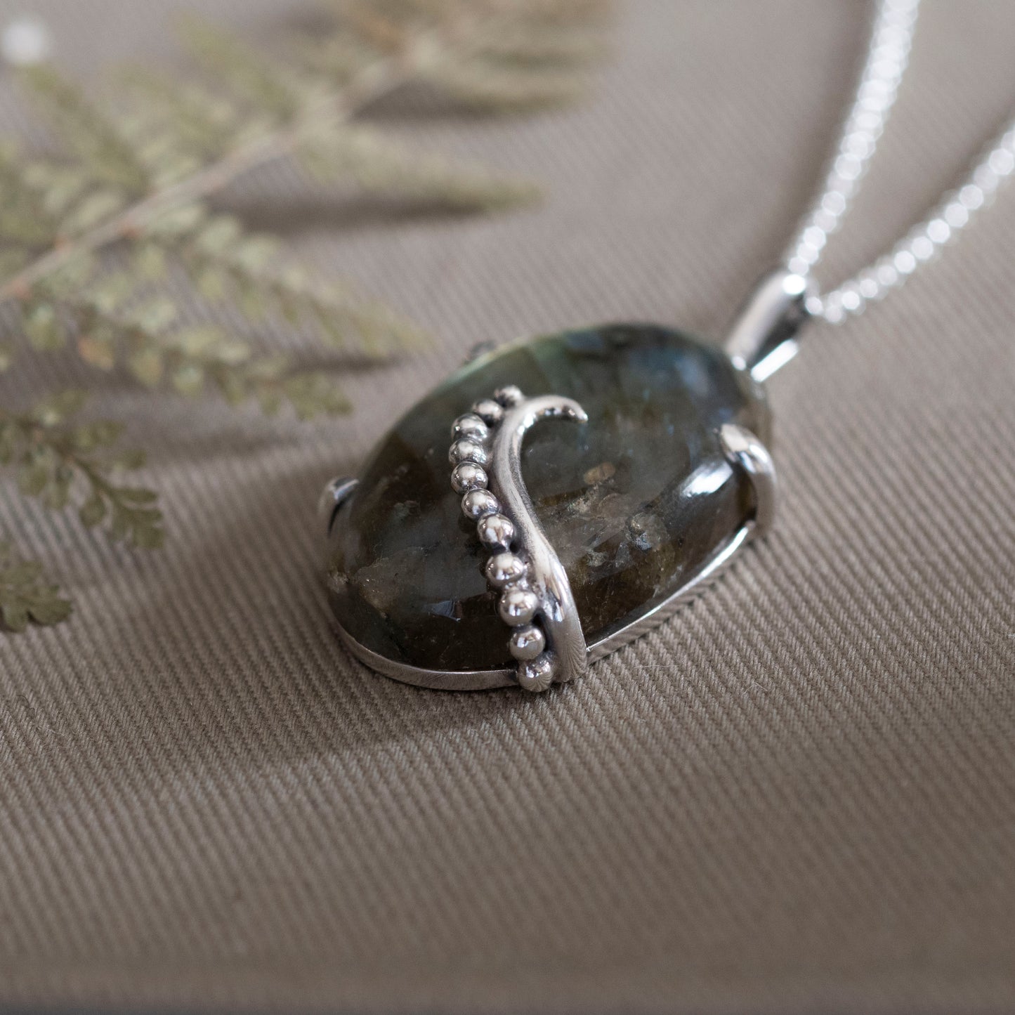 the Uncurling Aurora Pendant - Hebel Design