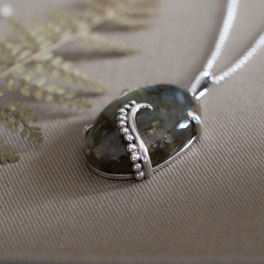 the Uncurling Aurora Pendant - Hebel Design