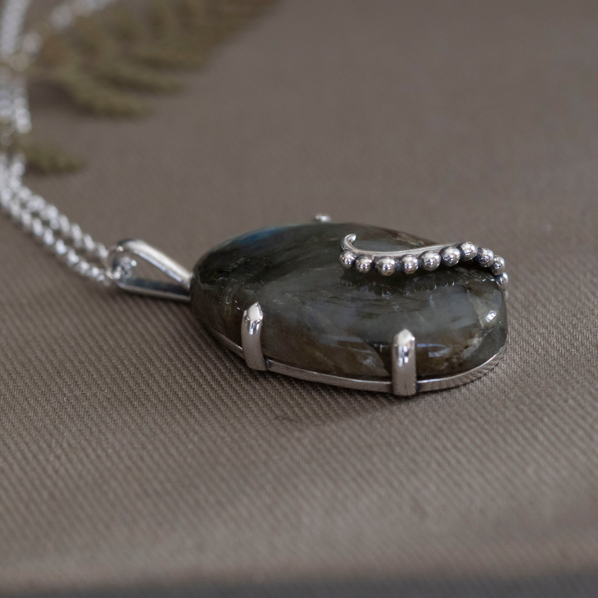 the Uncurling Aurora Pendant - Hebel Design