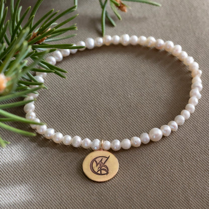 Tessa Gray Pearl Stretchy Bracelet with Brass Wedded Union Rune Medal