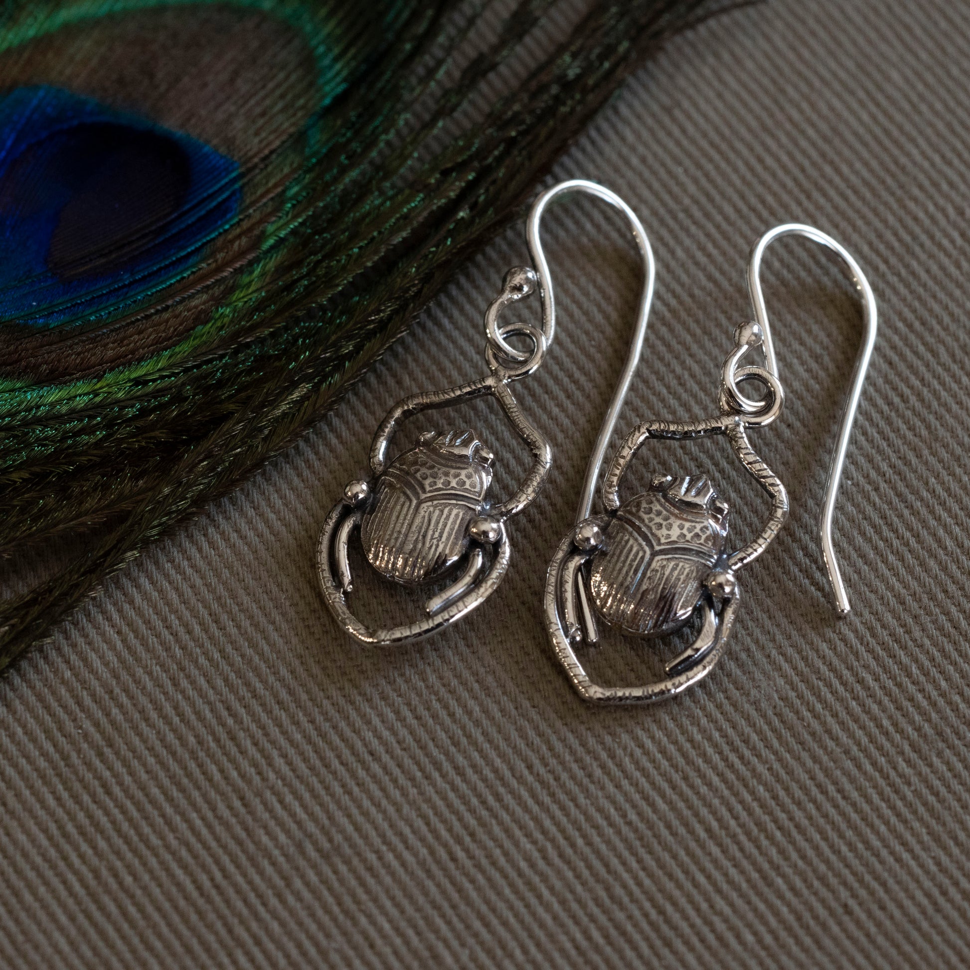 Sterling silver scarab earrings pressed from a 1900s vintage jewelry die, inspired by the Shadowhunters Last King of Faerie book cover