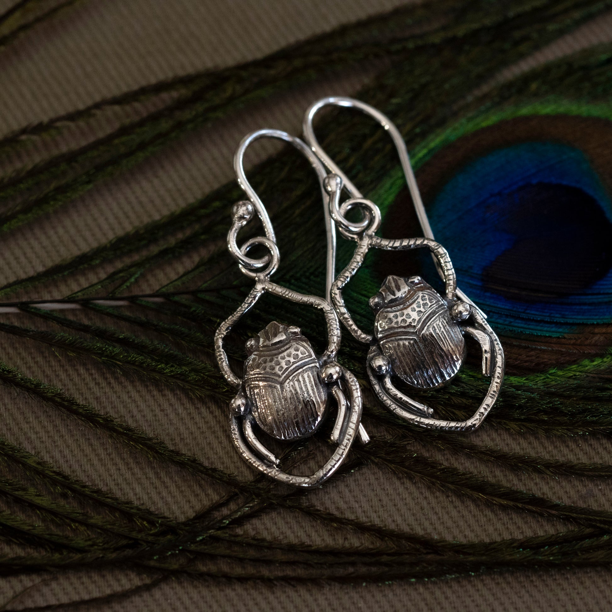 Sterling silver scarab earrings pressed from a 1900s vintage jewelry die, inspired by the Shadowhunters Last King of Faerie book cover
