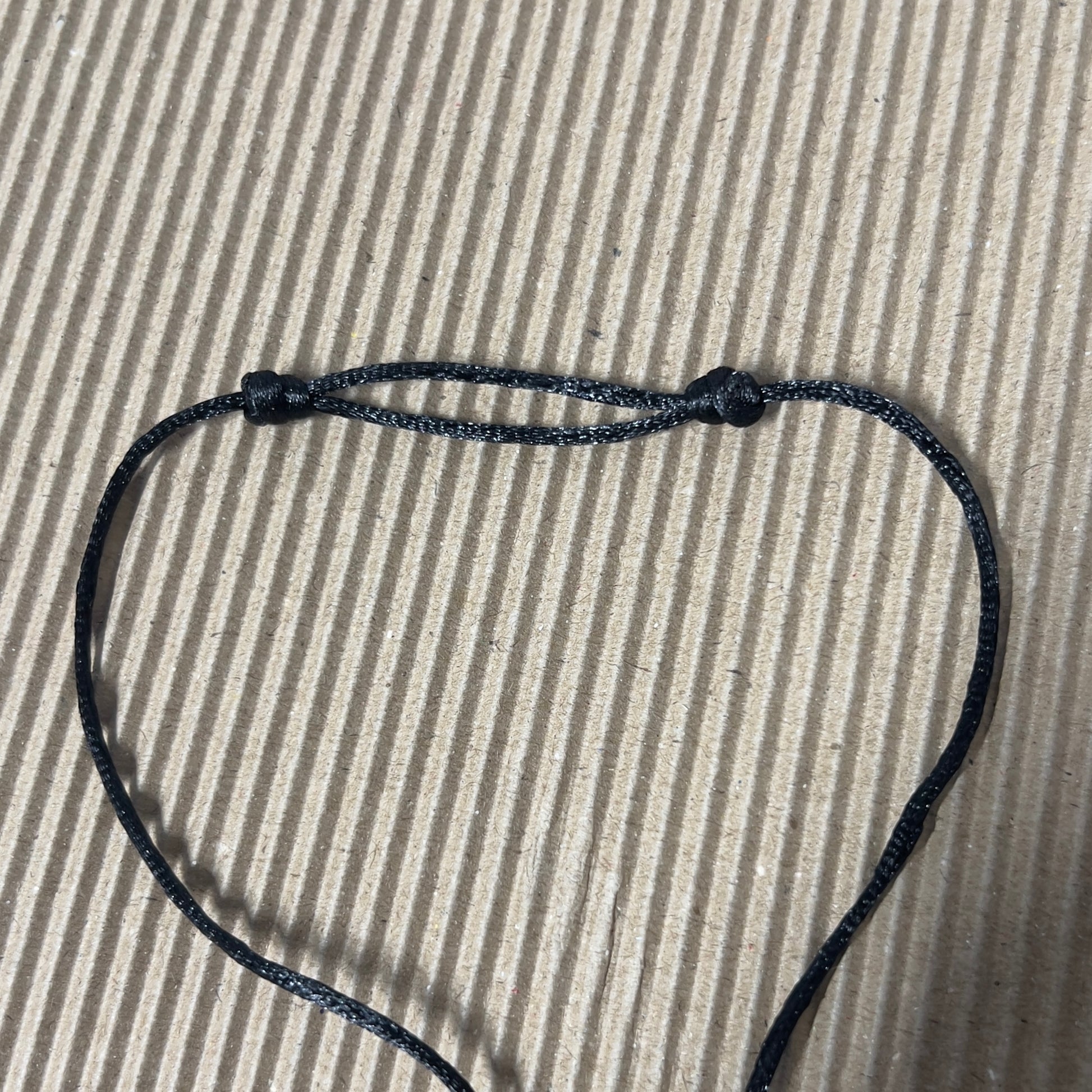 Black satin cord with sliding knots