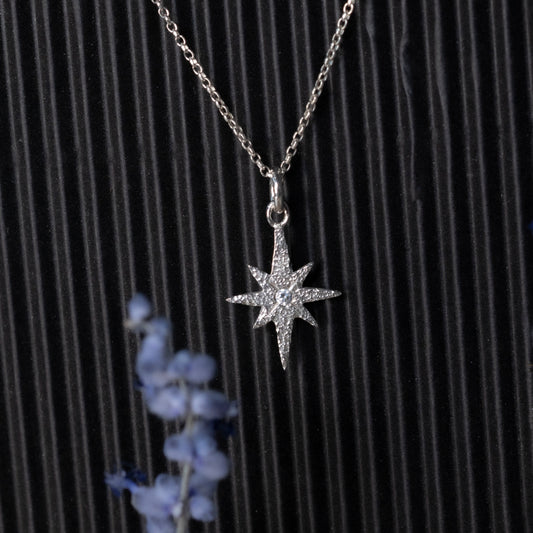 Delicate sterling silver Starborn pendant with an elongated 8-point star design