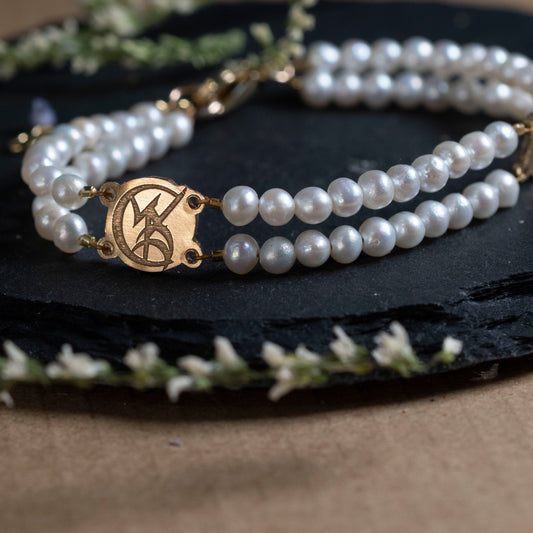 Close-up of the Wedded Union Rune on the pearl bracelet.