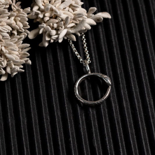 tiny ouroboros necklace in silver 