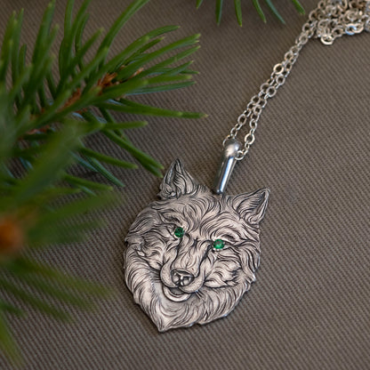 A wolf’s head was set in the steel, its eyes bejeweled in green