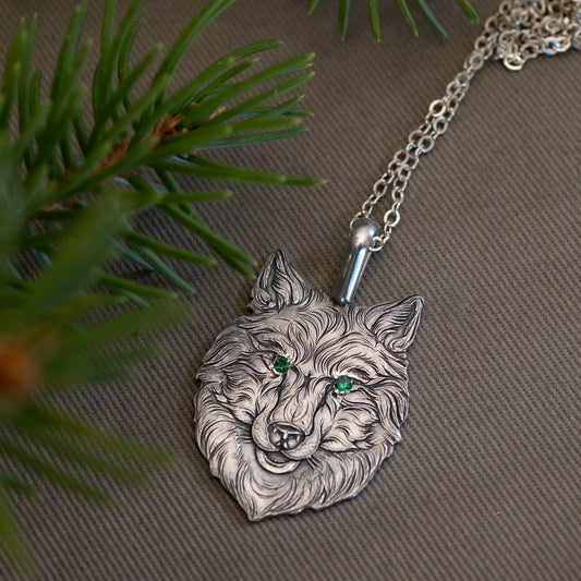 A wolf’s head was set in the steel, its eyes bejeweled in green